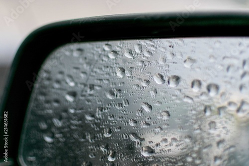 Drops of water, rain on a black car.