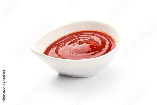 Bowl of ketchup or tomato sauce, isolated on white background.