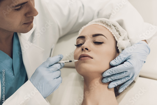 Close up. Doctor Doing Procedure in Modern Clinic.