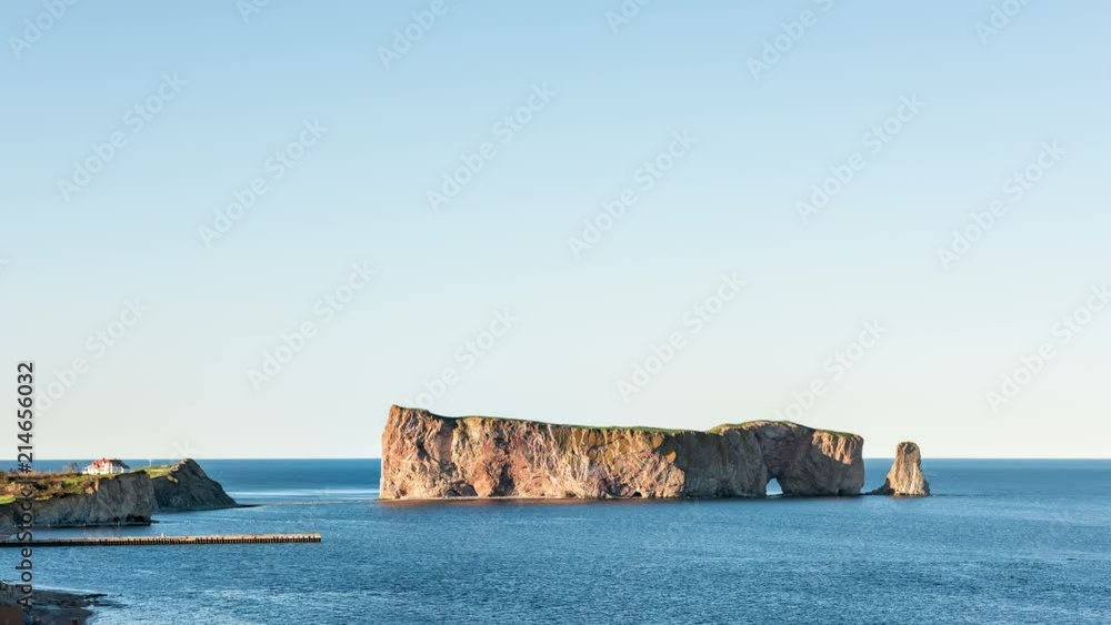 Timelapse, time lapse of sunset, dusk, twilight of Rocher Perce rock in Gaspe Peninsula, Quebec, Gaspesie region, Canada, Saint Lawrence Laurent gulf water, ships, boats, flying gannet birds Timelapse, time lapse of sunset, dusk, twilight of Rocher Perce rock in Gaspe Peninsula, Quebec, Gaspesie region, Canada, Saint Lawrence Laurent gulf water, ships, boats, flying gannet birds