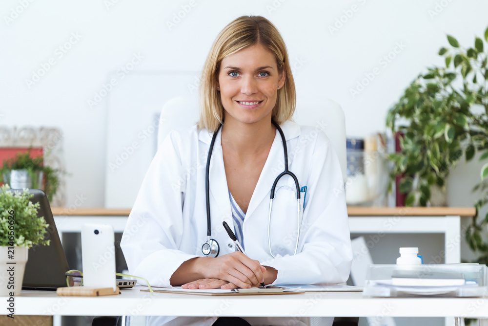 Female doctor working with laptop and researching some medication information in the consultation. Female doctor working with laptop and researching some medication information in the consultation.