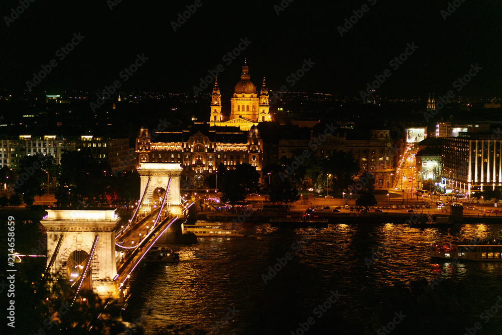 beautiful night view of chain bridge and river and city lights in Budapest city,  travel concept, space for text