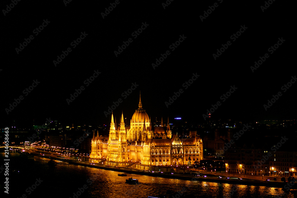 amazing night view of old  parliament building and river and city lights  in Budapest city, travel concept, space for text