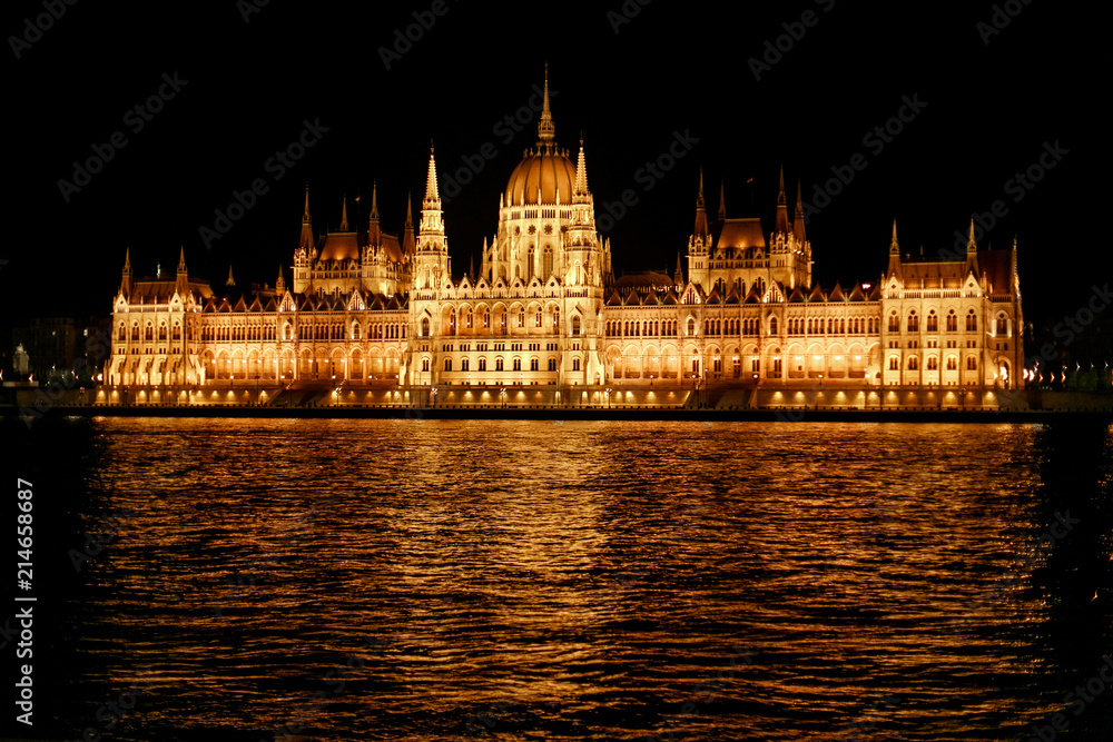 Naklejka premium amazing night view of parliament building and river and city lights in Budapest city, travel concept, space for text