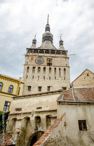 Clock Tower in Sighisoara with many old buildings in this beautiful world heritage site in Romania © alexionas