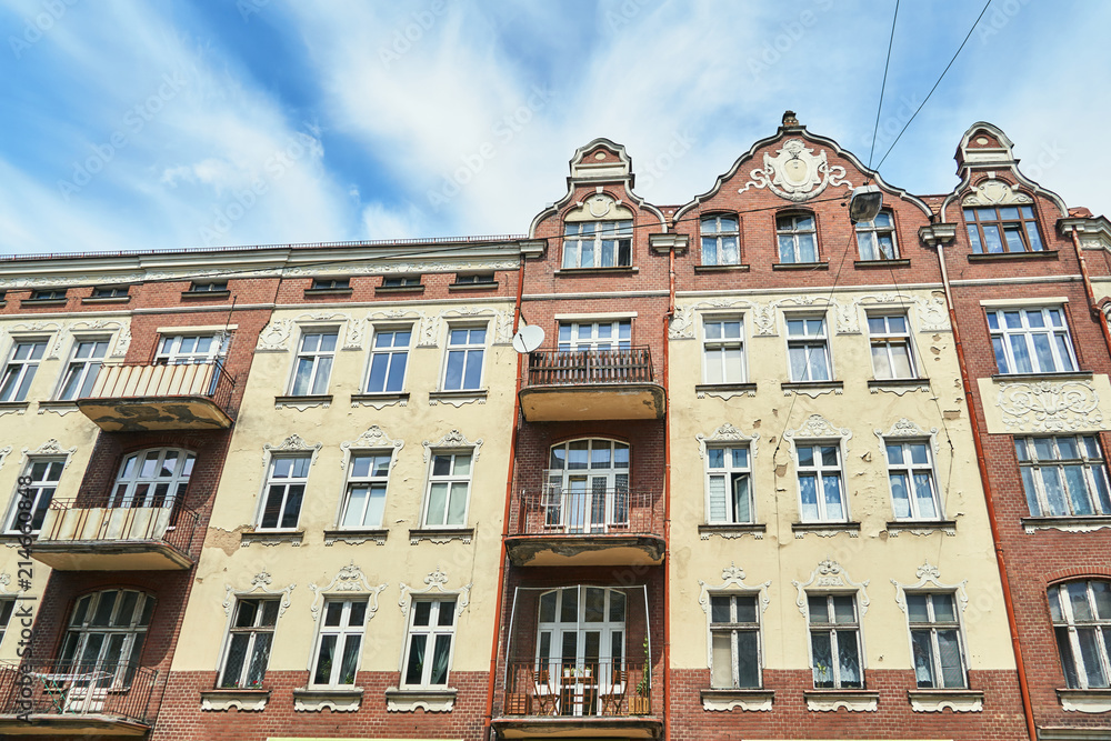 Facade of a residential building with balconies in Poznan.