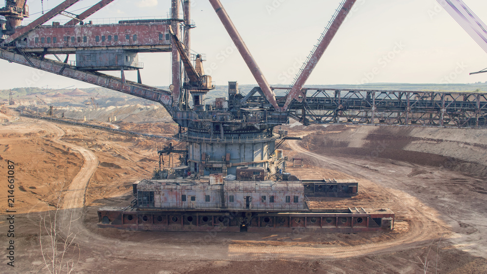 The operating machines in the quarry for the extraction of manganese ore