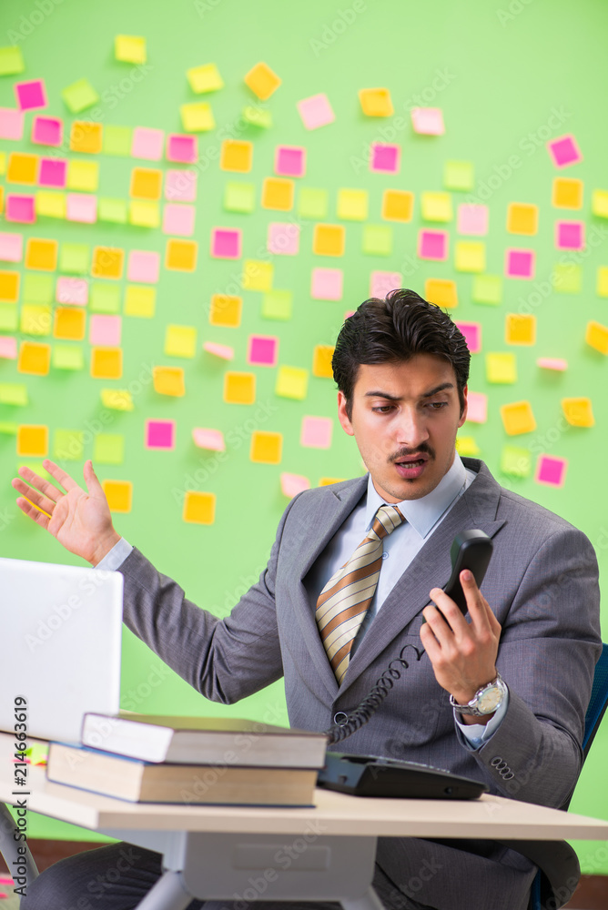 Businessman with many conflicting priorities Businessman with many conflicting priorities