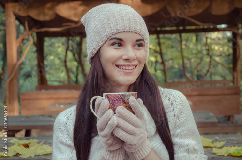 beautiful girl in a knitted hat and gloves