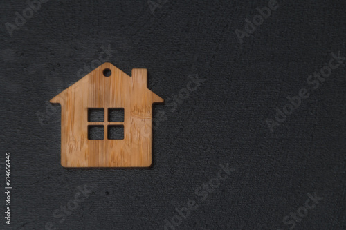 wooden house on black background.
