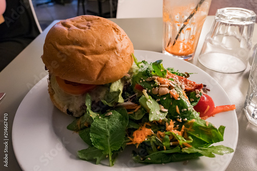 Photography Close up shot of delicious burger and salad
