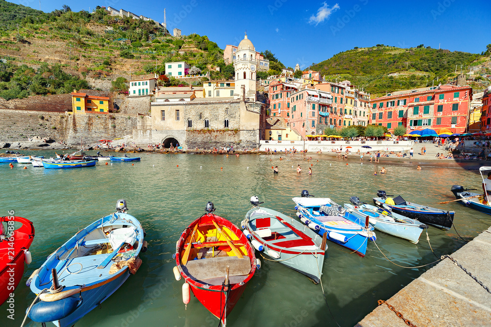 Vernazza. Fantastically beautiful coastal village Vernazza in Italy. Vernazza is one of the five city of famous national park Cinque Terre, UNESCO world heritage list. Boat at foreground in old port.