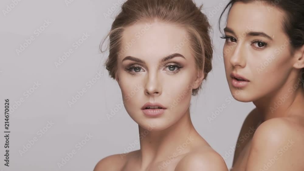 Two attractive girls at studio background Two attractive girls at studio background