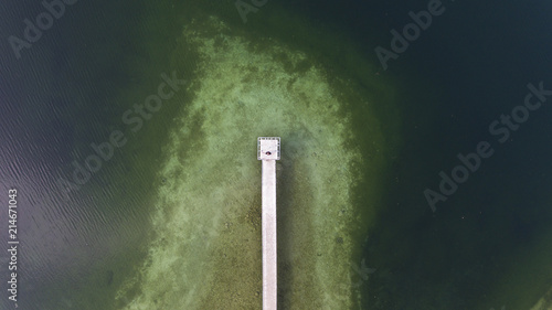 Top view aerial photo from flying drone of a beautiful sea landscape with amazing blue and green water with Turkey sea with pier.