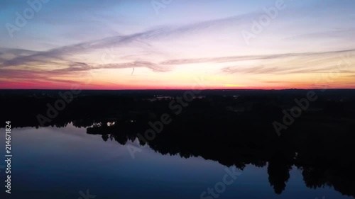 Wallpaper Mural flying over the lake and forest at sunset Torontodigital.ca
