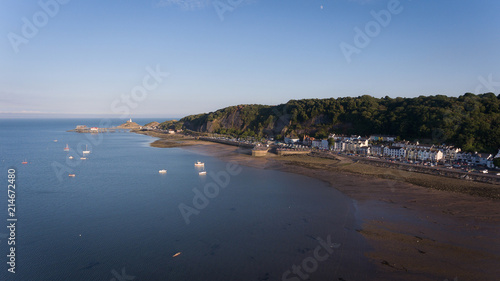 Editorial Swansea, UK - July 22, 2018: The tourist trap that is The Mumbles in Swansea, featuring the slipway, knab rock, the pier and lighthouse