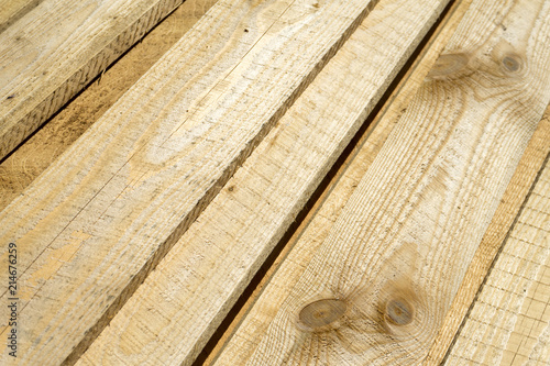 Rough sawn Scots pine boards stack on the construction site