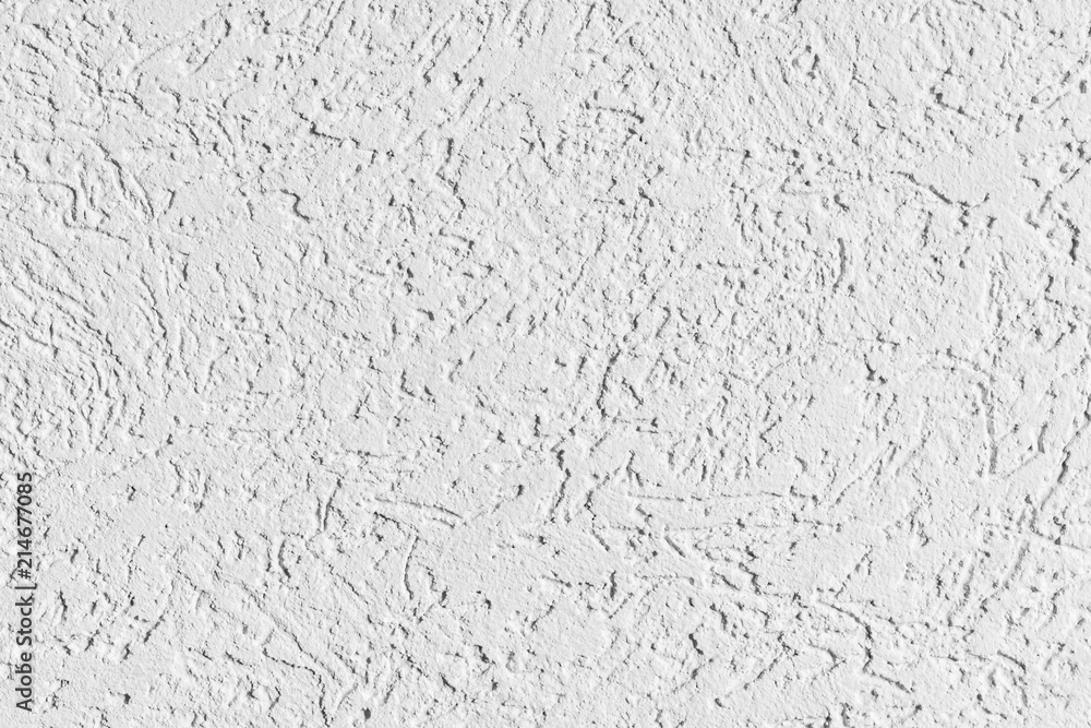 texture of the surface of the wall covered with decorative plaster of the woodworm type