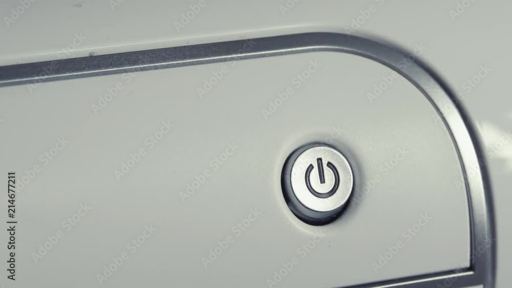 Male Finger Pressing On Off Button Printer