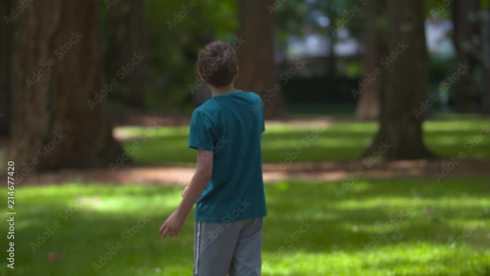 A boy playing frisbee golf and spiking his disc into the ground. Shot on a Blackmagic Ursa Mini Pro 4.6k with a Sigma 50-100mm f/1.8. A boy playing frisbee golf and spiking his disc into the ground. Shot on a Blackmagic Ursa Mini Pro 4.6k with a Sigma 50-100mm f/1.8.