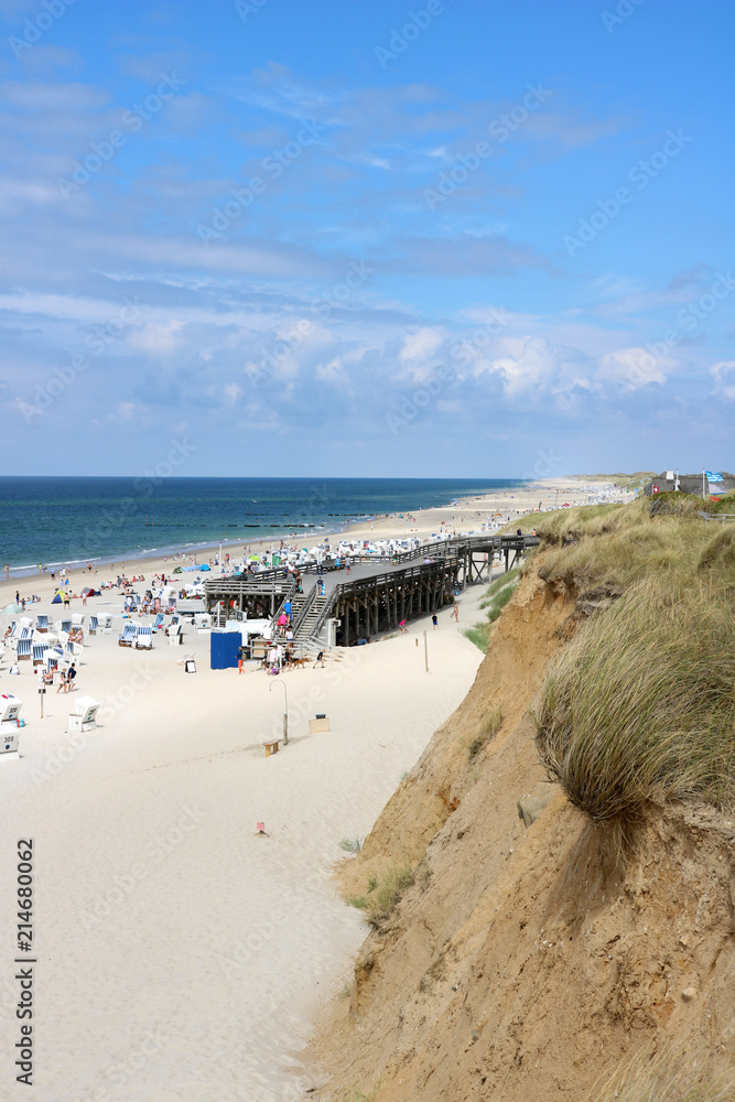 The red cliff at Kampen beach on a sunny summer day at high season on the island of Sylt, Germany