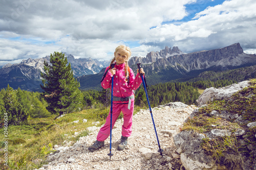 little girl hiker on a path