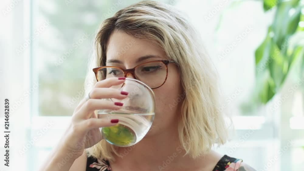 Closeup Portrait of Healthy Young Woman With Glasses Drinking Water Closeup Portrait of Healthy Young Woman With Glasses Drinking Water