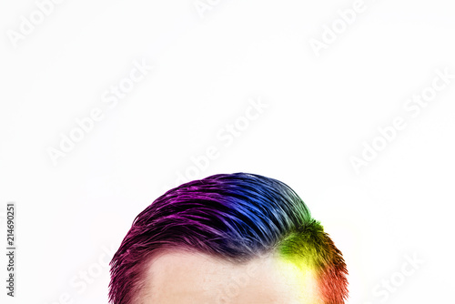 Colorful man's hair on a white background. A view of the hair in rainbow colors with side hairline isolated on a white background.