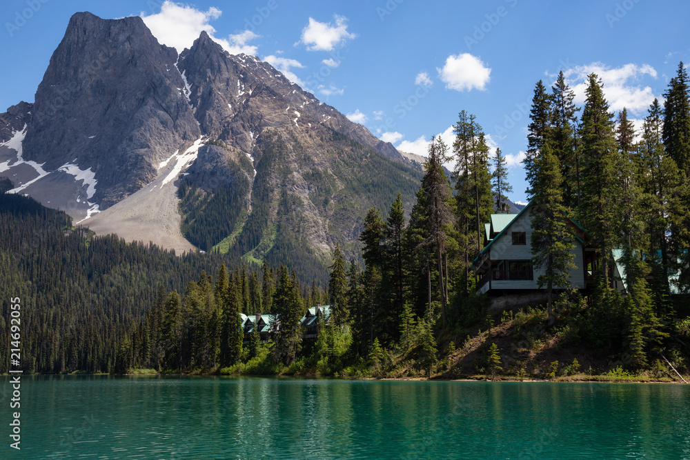Cabins in Emerald Lake during a vibrant sunny summer day. Located in British Columbia, Canada.