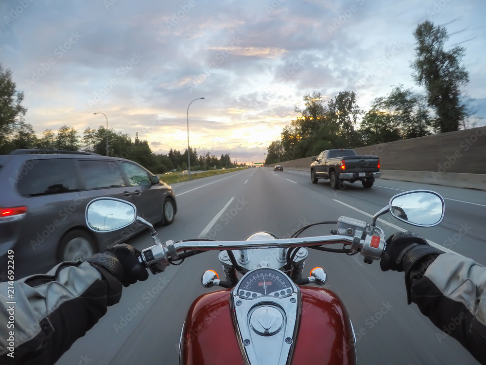 Naklejka premium Riding a motorcycle during a vibrant sunset. Taken in Surrey, Greater Vancouver, British Columbia, Canada.