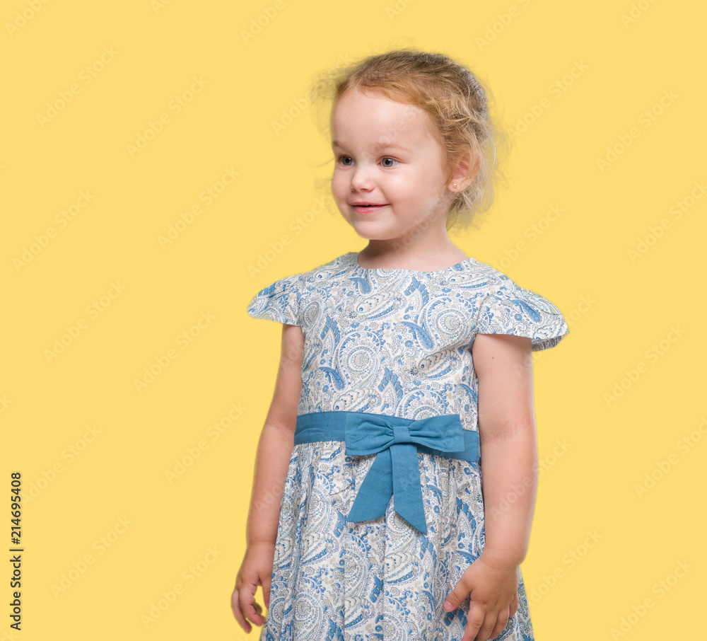 Beautiful blonde toddler gesturing
