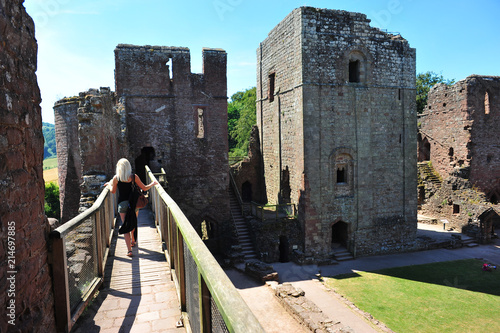 Young woman sight seeing at a castle. Goodrich castle photo