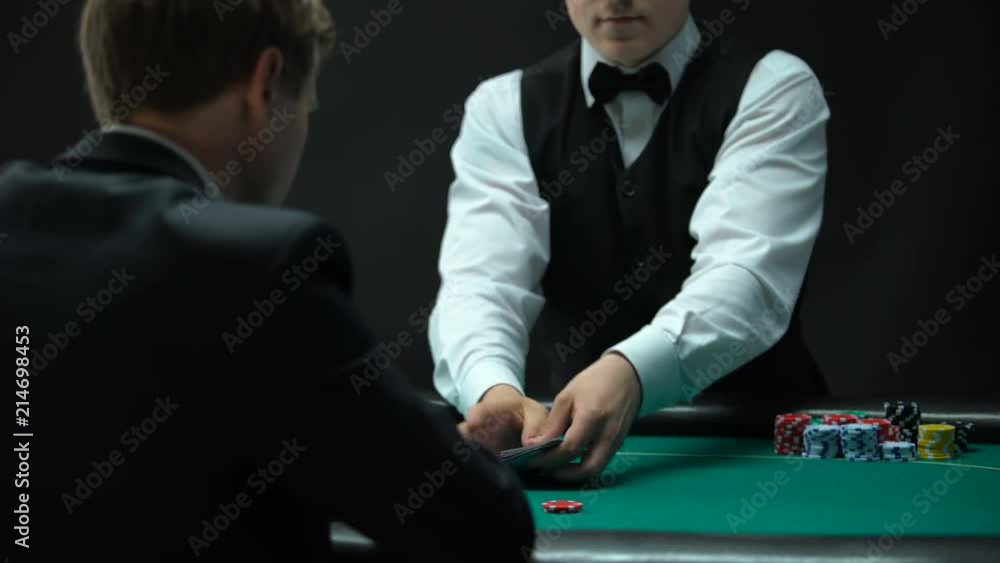 Experienced croupier making shuffling tricks and dealing cards, chance to win Experienced croupier making shuffling tricks and dealing cards, chance to win