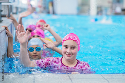 happy kids at the swimming pool. young and successful swimmers pose. © FS-Stock
