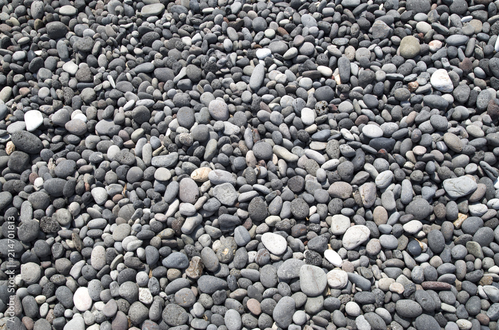 Gray and black pebbles on beach Gray and black pebbles on beach