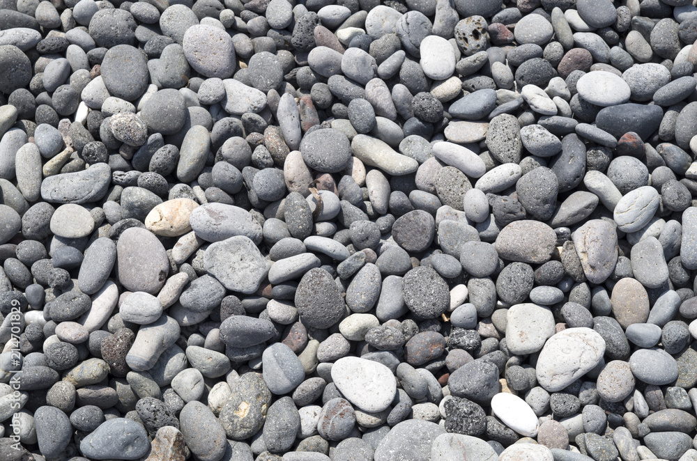 Gray and black pebbles on beach Gray and black pebbles on beach