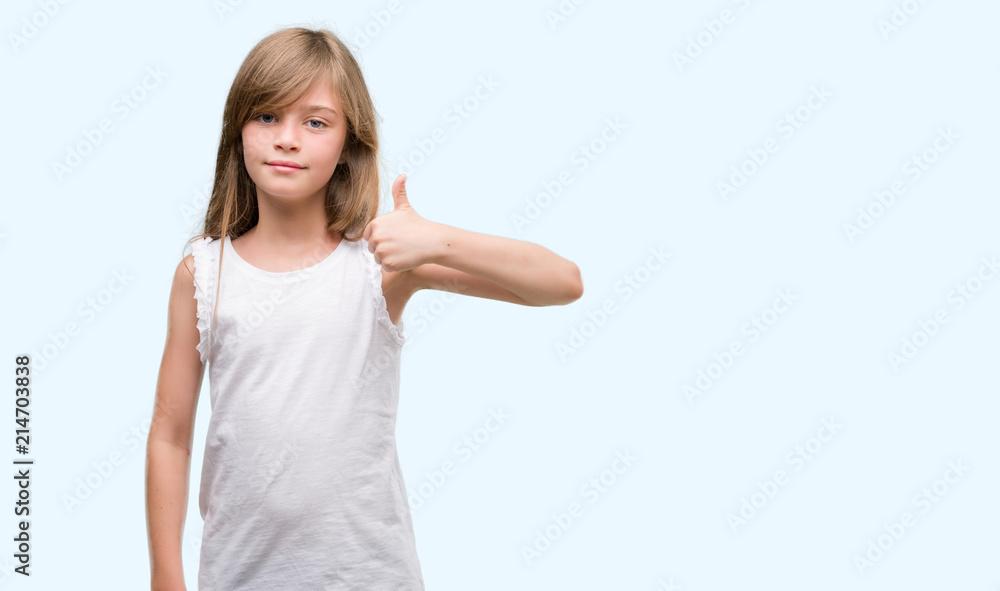 Young blonde toddler happy with big smile doing ok sign, thumb up with fingers, excellent sign Young blonde toddler happy with big smile doing ok sign, thumb up with fingers, excellent sign