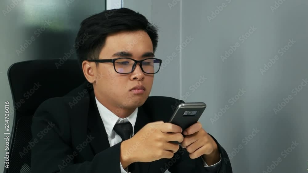 4k of young business man using a smartphone 4k of young business man using a smartphone