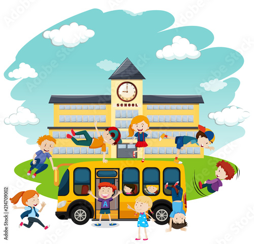 Children playing in front of school and bus