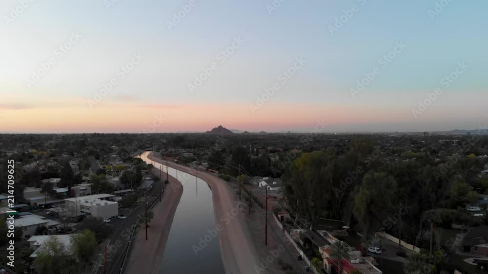 Flight at dusk in Phoenix with the sunrise Flight at dusk in Phoenix with the sunrise