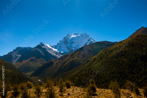 Beautiful mountain view with blue sky at Yading national reserve at Daocheng County, in the southwest of Sichuan Province, China.