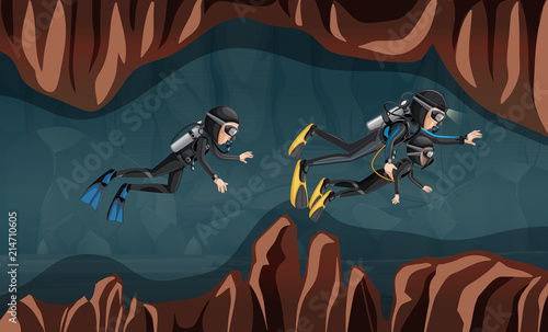 Divers guiding a young child through a cave
