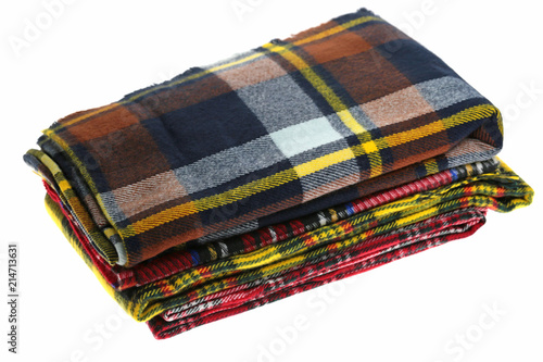 Scarf. checkered autumn scarves pile isolated on white background.