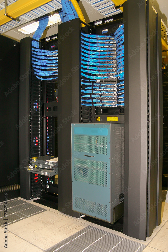 Portrait view of Computer Racks, equipment and cabling in a modern data