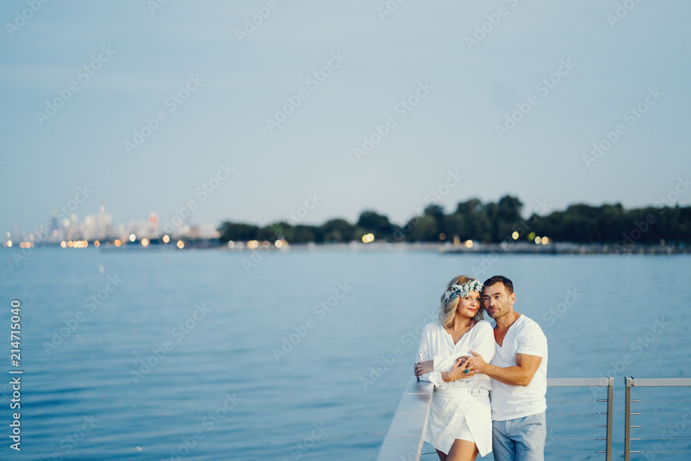 elegant adult couple near sea