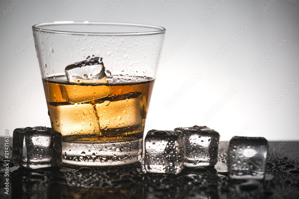 Glass of scotch whiskey with ice cube,Cold beverage of alcohol