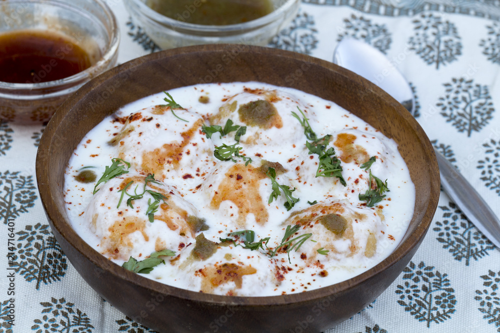 Dahi Vada or Dahi Bhalla are fried lentil dumplings, topped with curd, sweet and green chutney and spices. Dahi Vada or Dahi Bhalla are fried lentil dumplings, topped with curd, sweet and green chutney and spices.