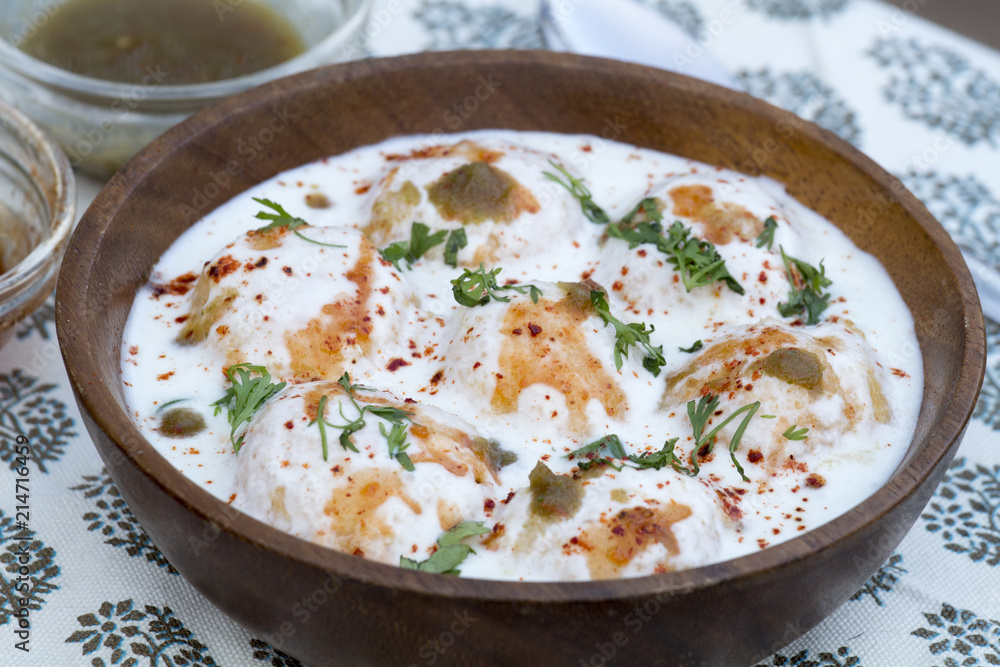 Dahi Vada or Dahi Bhalla are fried lentil dumplings, topped with curd, sweet and green chutney and spices. Dahi Vada or Dahi Bhalla are fried lentil dumplings, topped with curd, sweet and green chutney and spices.