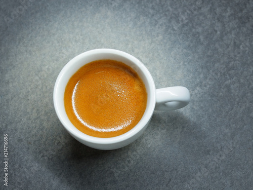 Фотография Cup of Espresso coffee on board background, Arabica with crema