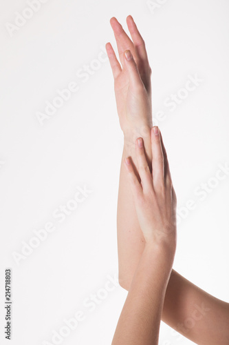 two women's hands on a white background. Empty hand isolated on white